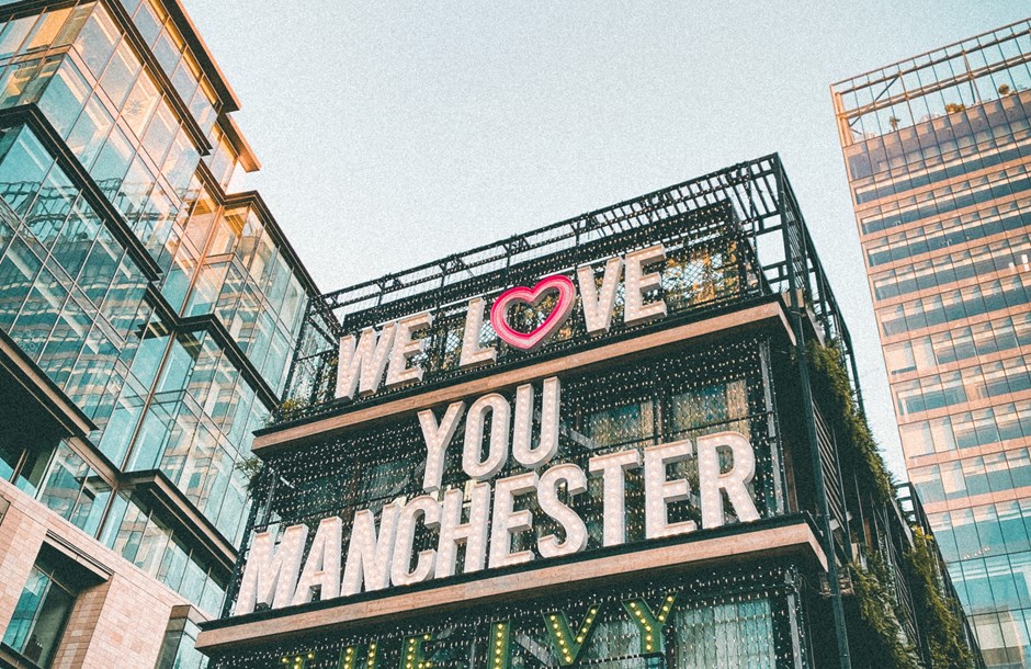 A building emblazoned with the words ‘We Love You Manchester’  