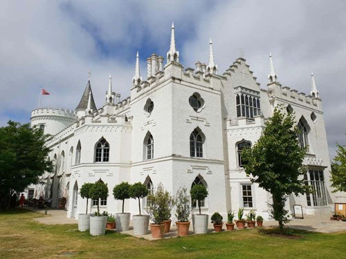 A white Gothic style three storey mansion with elaborate castle-like features