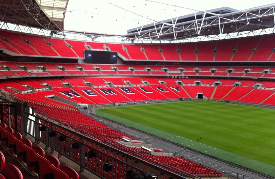 The seats and pitch of Wembley stadium